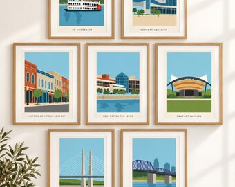 May include: A gallery wall set of seven framed art prints featuring Newport landmarks: BB Riverboats, Newport Aquarium, Historic Downtown Newport, Newport on the Levee, Newport Pavilion, Newport South Bank Bridge, and the Purple People Bridge.