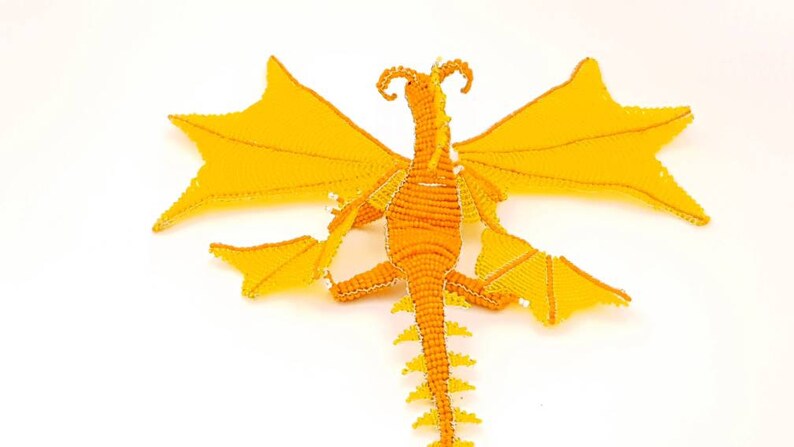 Orange and yellow dragons in pearls