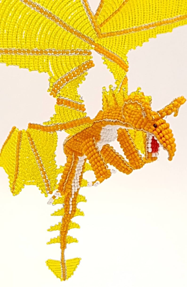 Orange and yellow dragons in pearls