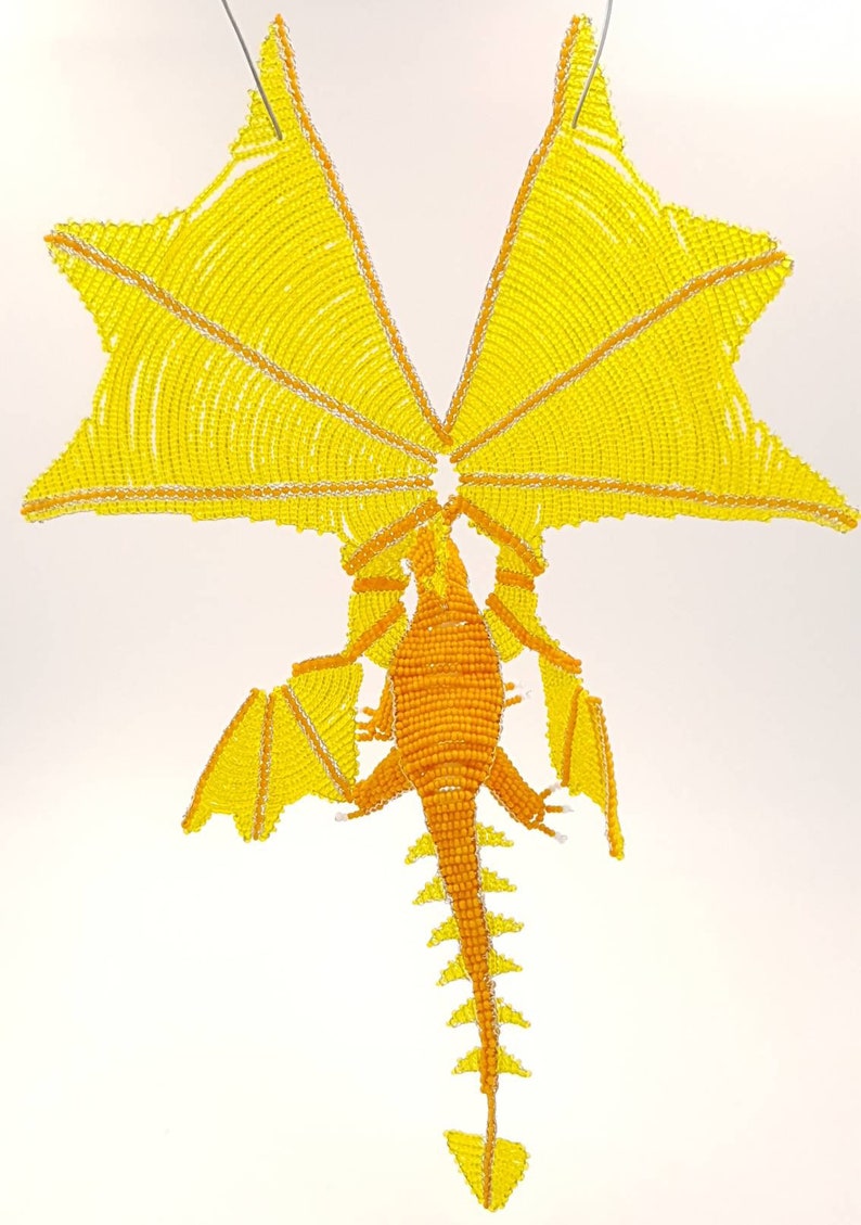 Orange and yellow dragons in pearls