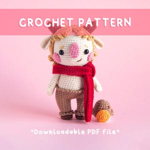May include: A crocheted doll with a whimsical design, featuring a red scarf, brown pants, and a mushroom accessory. The doll has a pink nose and cheeks, with the words "CROCHET PATTERN" and "*Downloadable PDF file*" in white text.