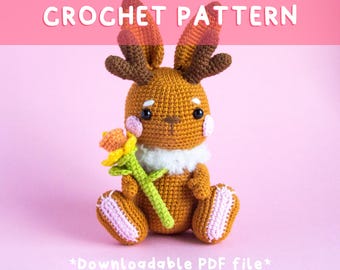 May include: Crochet pattern for a brown bunny with antlers holding a yellow flower. The pattern is downloadable as a PDF file.  *Downloadable PDF file*