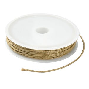 May include: A spool of natural-colored twine sits on a white plastic base. The twine is tightly wound, with a single strand extending from the roll. The twine appears to be made of a natural fiber.