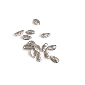 x50 Mini leaf charms, 7mm, in stainless steel