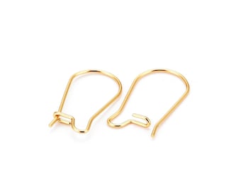 May include: Two gold-colored earring hooks are displayed against a white background. The hooks are made of thin wire, with a curved top and a small loop at the bottom for attaching earrings. The hooks are designed to be inserted through pierced ears.