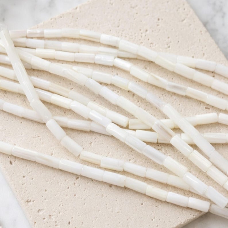Natural mother-of-pearl tube beads, 8x4mm, shell, husk, jewelry making in natural white mother-of-pearl. Strand approximately 37cm long. image 1