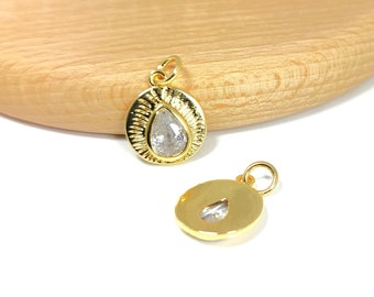 Round medal pendant with drop-shaped zircon cabochon, 14x12mm, sunray patterns, 18k gold-plated brass, sold individually