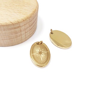 Oval pendant, star engraved medal in 14k gold-plated stainless steel, sold individually