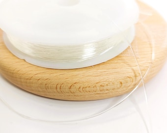 Transparent crystal elastic thread. 10.5m spool, 0.6mm diameter. Elastic cord for jewelry and bracelet making.