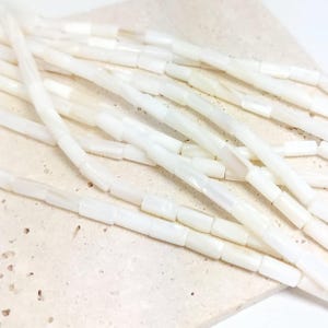 Natural mother-of-pearl tube beads, 8x4mm, shell, husk, jewelry making in natural white mother-of-pearl. Strand approximately 37cm long. image 2