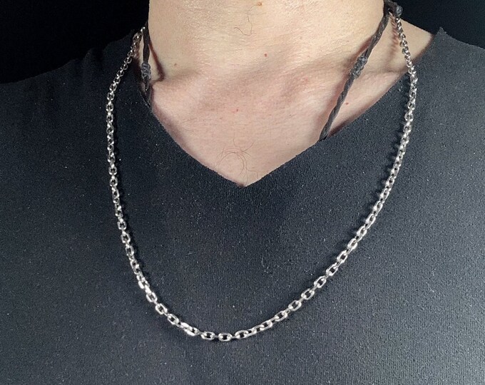 Silver chain 925. Convicted mesh. Hook clasp. Length 64cm, weight of 23 grams. width and length of mesh 3mm/ 5mm