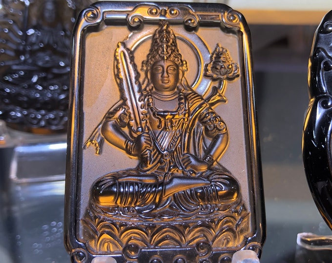 Buddhist pendant amulet, bodhisattva Manjushri (knowledge) obsidian ice.