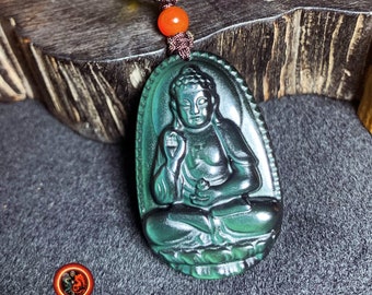 Pendant, Buddha, Amitabha. Buddhist amulet in obsidian celeste eye. obsidian natural celeste eye from Mexico. Cord, jade.