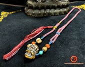 Tibetan Buddhist necklace. Mahakala, Netsuké carved handcrafted in deer wood. Turquoise, agate nan hong braided by hand Rare piece