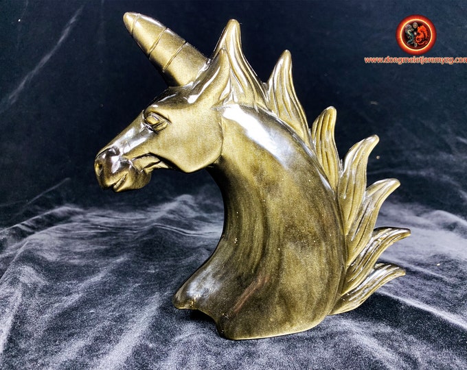 Golden obsidian unicorn from Mexico of AAA quality. Exceptional piece entirely carved by hand. 19cm high 14cm wide.