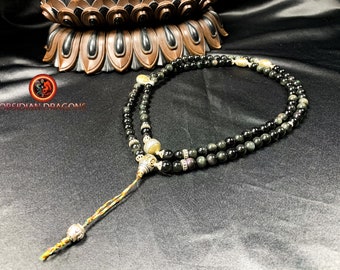 Mala, traditional and artisanal Tibetan Buddhist rosary. 108 obsidian beads eye celeste 8mm in diameter. Silver 925 and copper