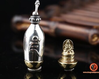 pendant, ghau Tibetan Buddhism. Buddha. Jambhala in its yellow form. Deity of wealth. mantra syllable "DZAM" silver 925 and copper