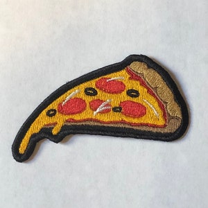 May include: A yellow and red embroidered pizza slice patch with black stitching. The pizza has pepperoni and black olives.
