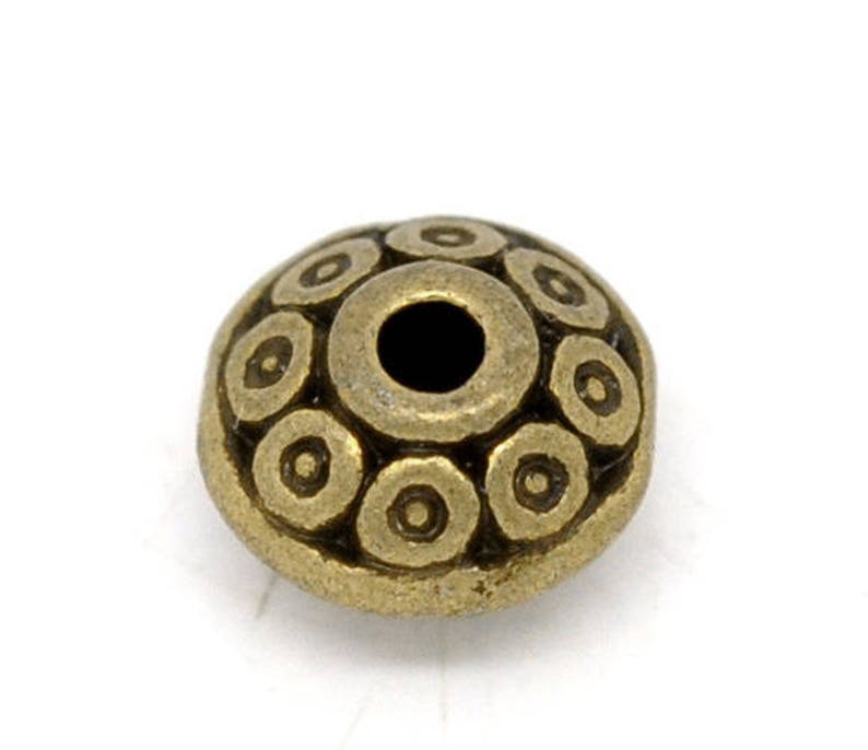 Infill beads flying saucers in bronze colored metal