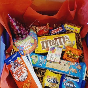 Party in a Box. Celebrate with a delightful assortment of snacks, balloons, and surprises, perfect for a fun party gift!