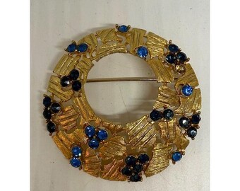 Vintage Unsigned Gold Tone Blue Rhinestone Round Brooch