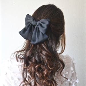 Large bow tie hair barrette in black or blue fabric. Bridesmaid accessory. Marriage.