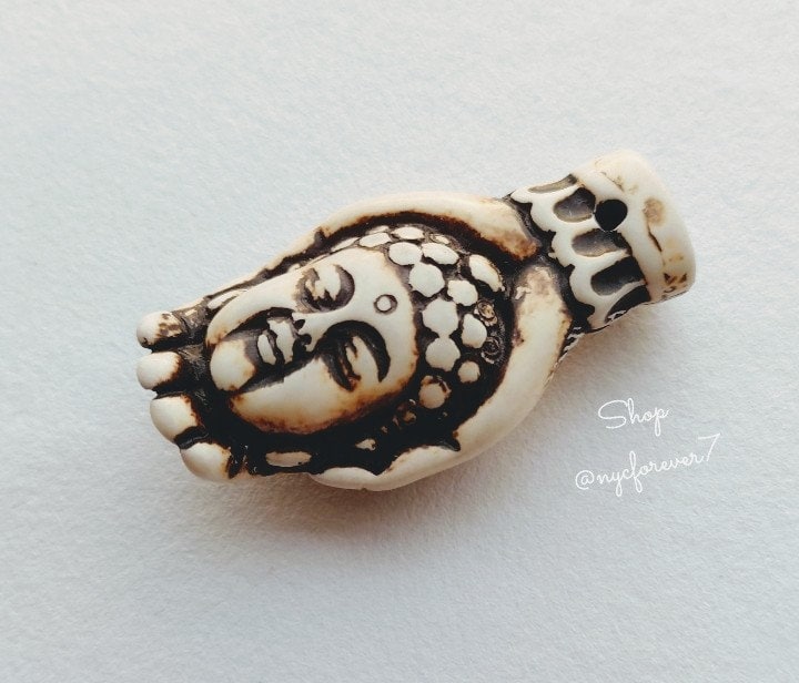 Ivory buddha pendant store