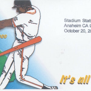May include: A baseball-themed envelope with a cartoon illustration of two baseball players facing each other. The envelope has the text "Stadium Station Anaheim CA 92825 October 20, 2002" and "It's all California!" printed on it.