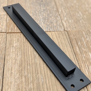 Low profile sliding barn door handles