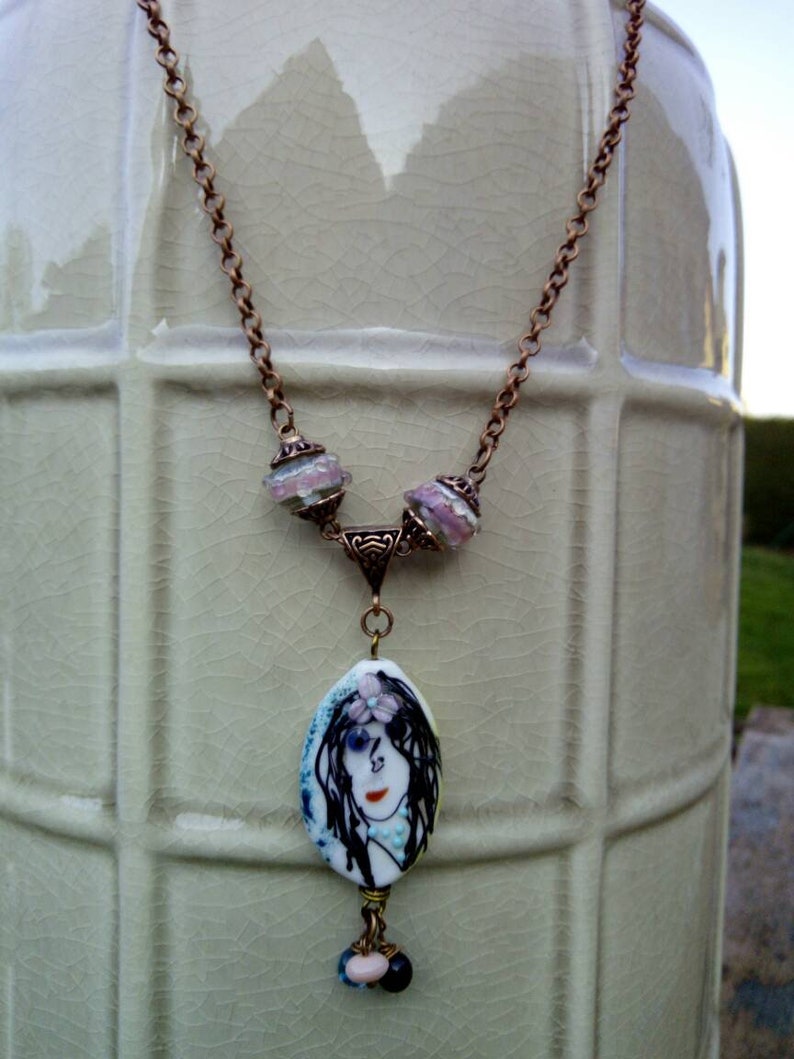 lobster clasp copper metal The Lady on glass bead spun torch pendant