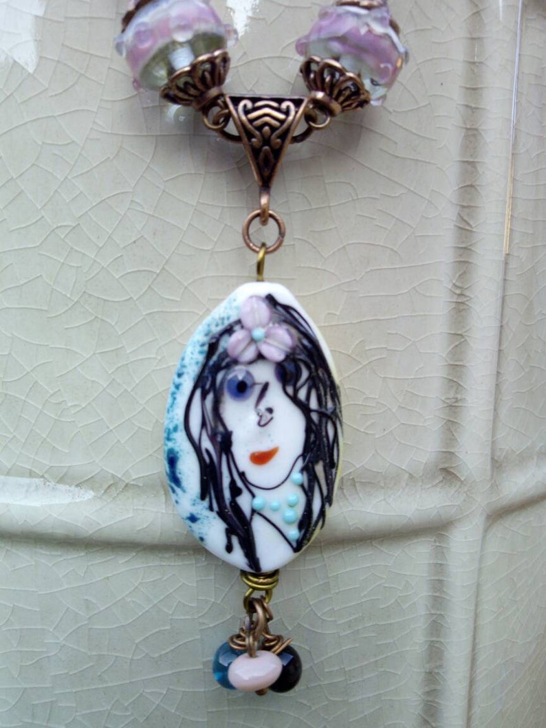 lobster clasp copper metal The Lady on glass bead spun torch pendant