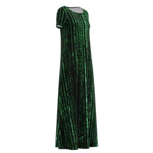 May include: A long black dress featuring a green digital rain pattern. The dress has short sleeves and a round neckline. The fabric is printed with vertical lines of green characters, creating a code-like design.