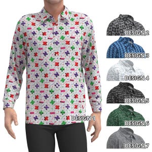 Può includere: Una camicia a maniche lunghe con sfondo bianco e un motivo ripetuto di simboli matematici colorati. L'immagine mostra anche altri sei modelli di camicie con motivi diversi, etichettati da "DESIGN 2" a "DESIGN 7".
