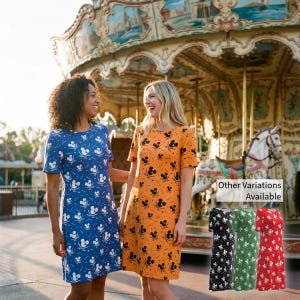 May include: Two women wearing short-sleeved dresses with a Mickey Mouse pattern. One dress is blue with white Mickey Mouse designs, and the other is orange with black Mickey Mouse designs. Additional dress color variations are shown in black, green, and red.