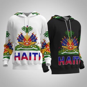 May include: Two hooded sweatshirts, one white and one black, featuring the Haitian coat of arms and the word "HAITI" in red, white, and blue. The design includes a palm tree and cannons. The sleeves and hood lining have a green and white pattern.