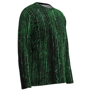 May include: Black long-sleeved top with a green digital rain design. The pattern consists of vertical lines of green characters, resembling code. The shirt has a crew neck and a relaxed fit, ideal for everyday wear. The design is reminiscent of the Matrix.