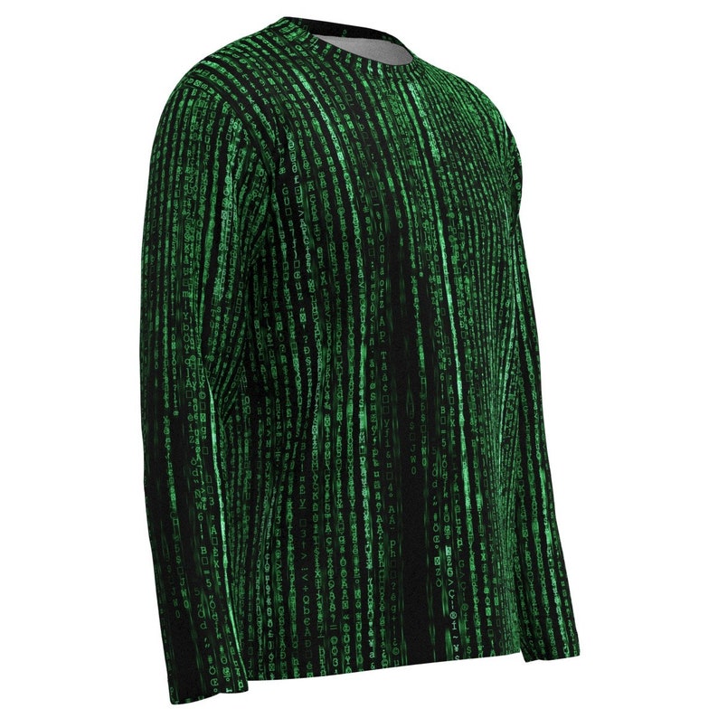 May include: Black long-sleeved top with a green digital rain design. The pattern consists of vertical lines of green characters, resembling code. The shirt has a crew neck and a relaxed fit, ideal for everyday wear. The design is reminiscent of the Matrix.