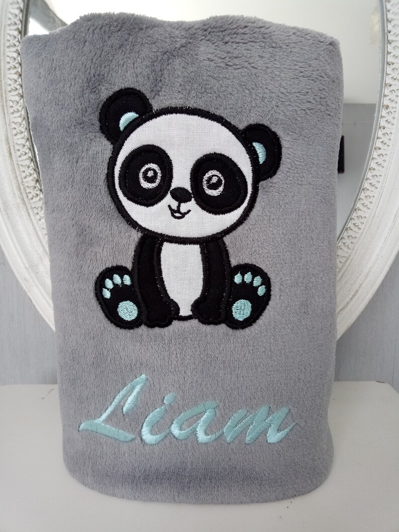 May include: Gray plush blanket with an embroidered panda bear and the name "Liam" in light blue thread.