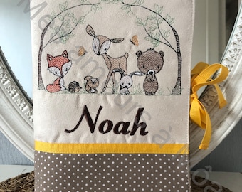 Personalized embroidered baby health record book cover with forest animal motifs