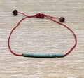 Adjustable bracelet with small turquoises beads - different thread colours available product logo