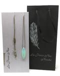 Adjustable necklace with a large marquise cut Chalcedony, nylon thread, rock crystal and silver feather - different thread colours available product logo