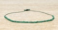 Green Onyx Bracelet with av. 50 small gemstones - Dark green nylon thread - Minimalistic and adjustable - Gift idea for her product logo