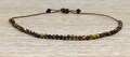 Adjustable bracelet with 50 small Tiger's Eyes - Various thread colours available - 18th birthday gemstone product logo