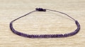 Purple Amethyst Bracelet with av. 50 small gemstones - Purple nylon thread - February birthstone - Minimalistic - Gift idea for her product logo