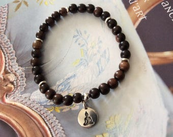 Bracelet men or women, exotic wood of Kamagong, charm plated sitting Buddha silver beads