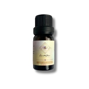 May include: A small amber glass bottle with a black cap, containing essential oil. The label is white with a gold star and the text "Earth Star Collection" and "Of The Light".
