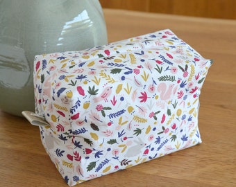 Flowery toiletry bag white background