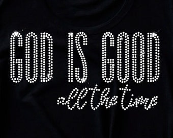 May include: Black t-shirt with the words "God is Good all the time" in rhinestones.