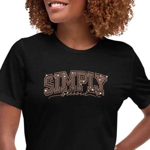 May include: Black t-shirt with the words "SIMPLY Blessed" in rhinestones.