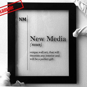 May include: Black and white framed print with the text "New Media (noun)" and a definition: "unique wall art, that will decorate any interior and will be a perfect gift"